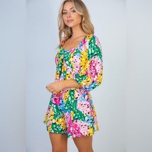 NEW Multi colored romper with boat neck & puff sleeves